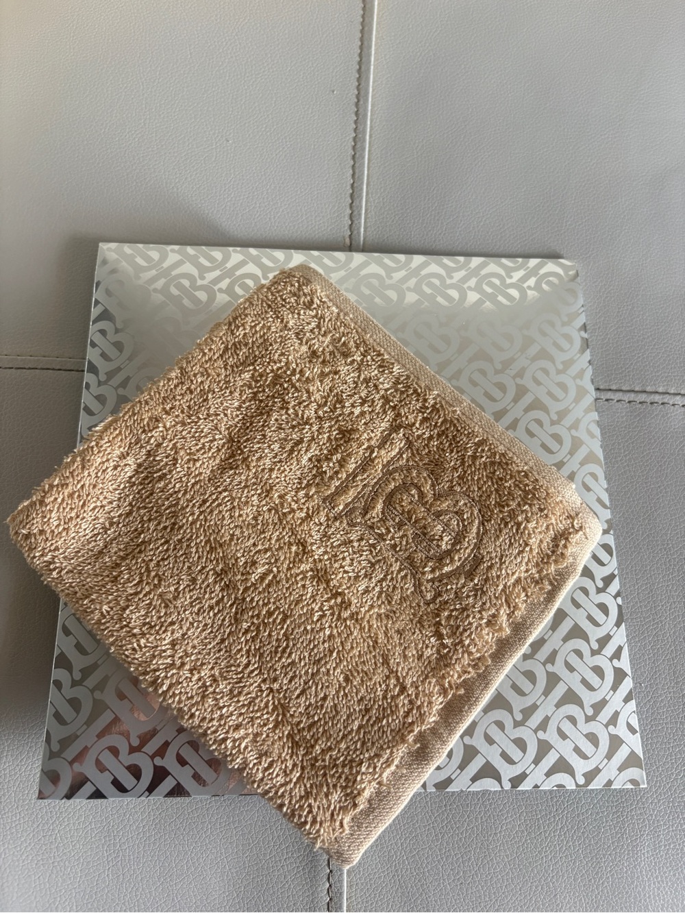 Burberry Beige Embossed Monogram Wash Cloth